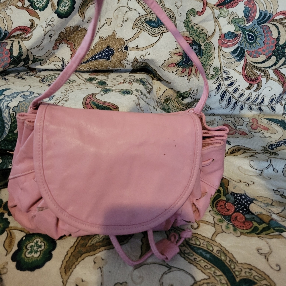 A unique little pink leather handbag
